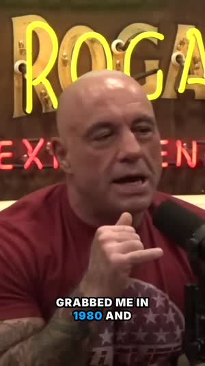 Joe Rogan gesturing, captioned vertical clip