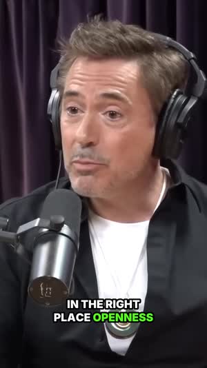 Robert Downey Jr. in headphones, captioned vertical clip