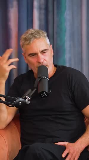 Joaquin Phoenix reacting, captioned vertical clip