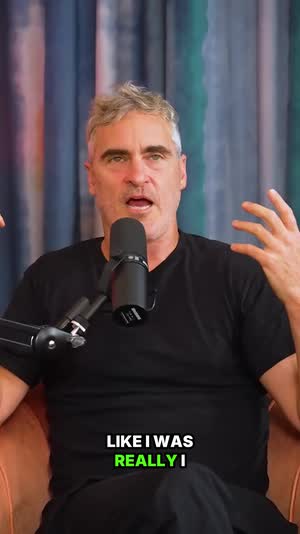 Joaquin Phoenix gesturing, captioned vertical clip